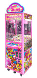 A pink and multicolored candy-themed arcade crane game machine.