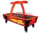 Commercial air hockey table with red and black colors, featuring a glowing playing surface and overhead structure with LED lighting.