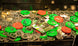 Collection of coins and tokens with green and red labels on a reflective surface