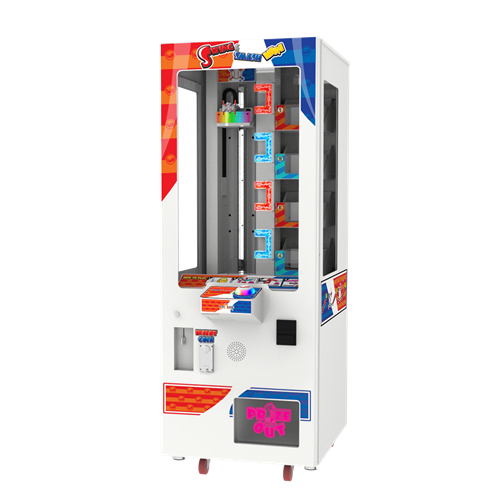 An image of a Komuse Swing & Smash Mini arcade machine, featuring a colorful cabinet with LED displays and buttons, designed for prize dispensing.