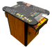 A commercial version of the Namco Pac-Man Pixel Bash arcade game in a cocktail cabinet format, featuring a color display with game graphics and a traditional wooden arcade cabinet.