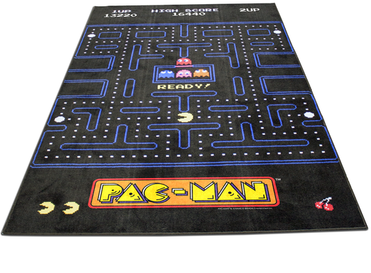 An area rug featuring the iconic Pac-Man game maze pattern with Pac-Man and the ghosts on a black background.