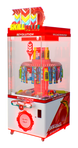 Red and white Skillfall Revolution arcade machine with colorful prizes on a white background