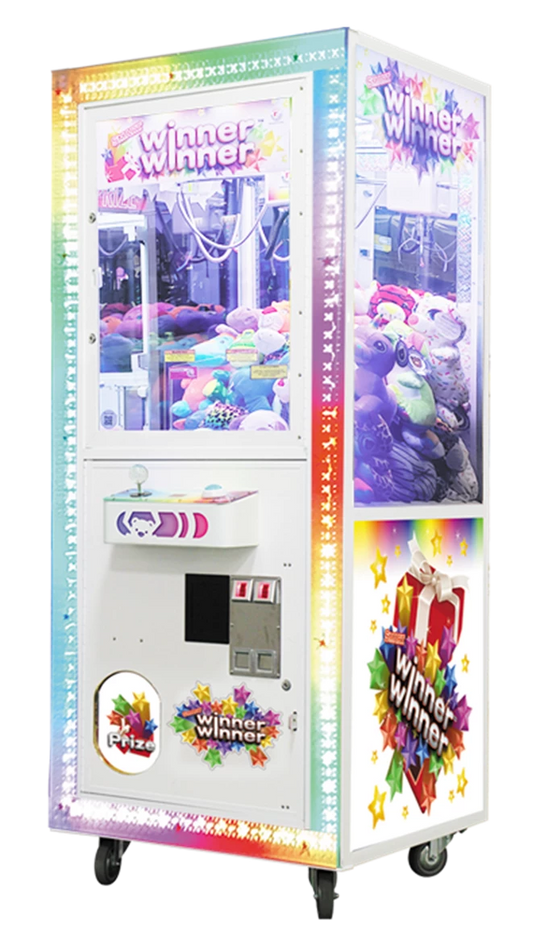 A multicolored Smart Industries Winner Winner 31 inch Crane machine with a special front lighted frame, featuring a joystick and buttons on the front console.
