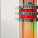 Decorative wall sconce with red central light and silver accents on a white background